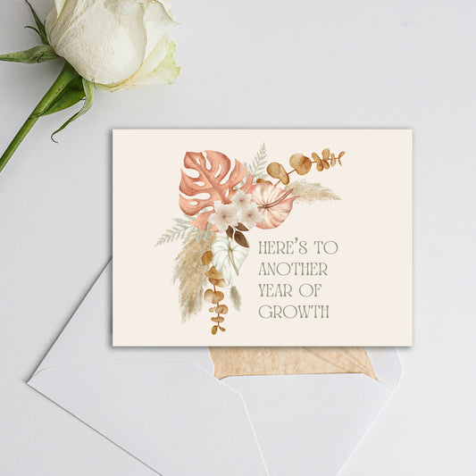 "here's to another year of growth" greeting card