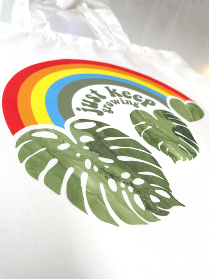 just keep growing rainbow monstera tote bag