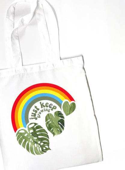 just keep growing rainbow monstera tote bag